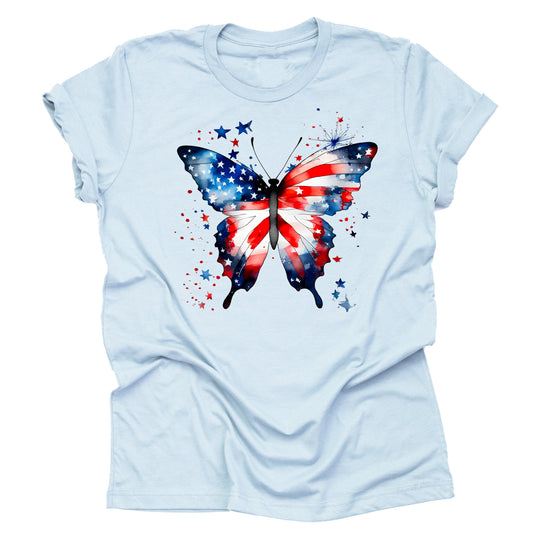 A light blue unisex short-sleeve T-shirt featuring a vibrant butterfly design with the American flag's stars and stripes.