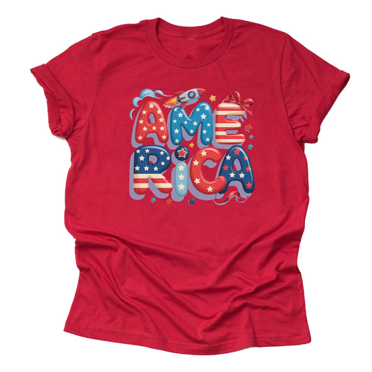 A red short-sleeved unisex T-shirt with a graphic that spells out 'america' in stylized lettering, featuring stars and stripes in red, white, and blue colors.
