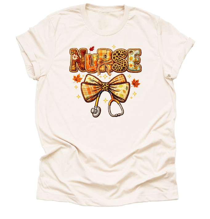 Cream fall nurse shirt with autumn bow design for RN nurses and healthcare workers