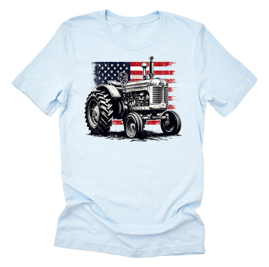 Light blue Unisex short-sleeve t-shirt with a graphic of a vintage tractor and the American flag in red, white, and blue colors.